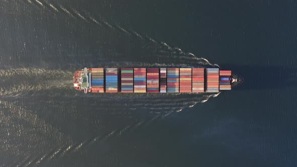 Drone View Vertically Downward on the Movement of the Container Ship at Sea