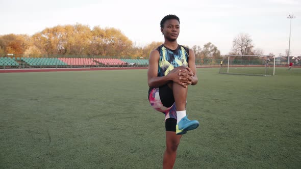 Confident Black Young Girl in Bright Uniform Goes in for Sports on the Soccer Field and Does Leg