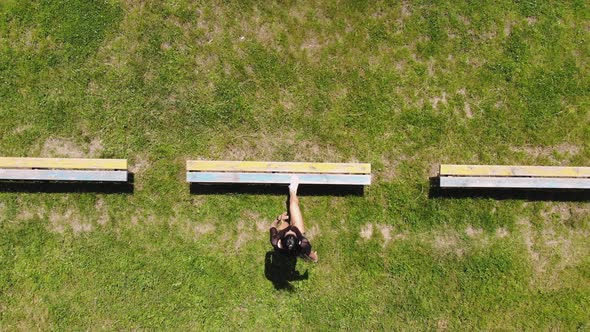 Aero, Top View, Young Fit Active Woman Doing Step Up Jumps on Bench, at Stadium. Outdoor Sports