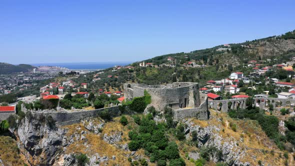 Rotating aerial 4k shot of the old Stari Bar fortress in Montenegro with the city of Bar and the Adr