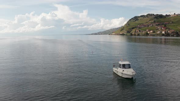 Aerial dolly of small boat on a beautiful lake