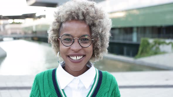 Cheerful African American Woman Laughing Looking Outdoors