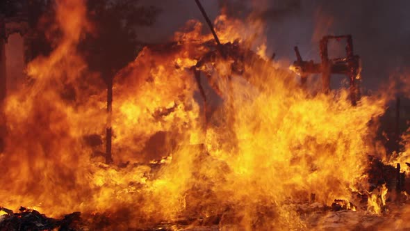 House on fire burning in slow motion