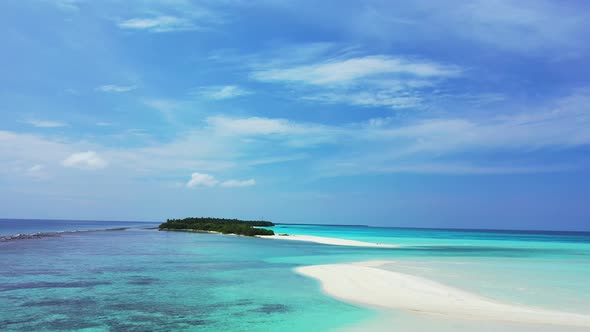 Luxury above travel shot of a white paradise beach and blue water background in colorful 4K