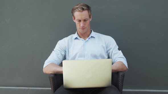 Businessman in White Shirt Opens Modern White Laptop and Starts to Work