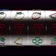 Modern Black Slot Machine Concept With Colorful Neon Lights Isolated On Black. 3D 4K Video. - VideoHive Item for Sale