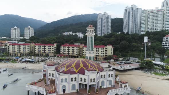 Revealing drone shot of the Tanjung Bungah Floating Mosque in Penang Malaysia