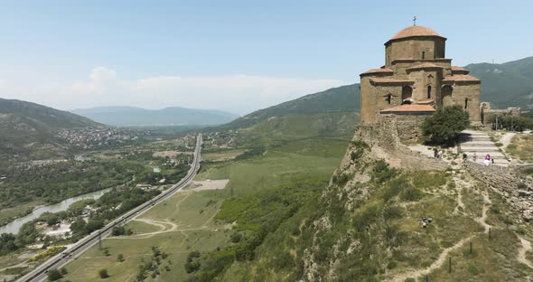 Fly By Medieval Georgian Church Of Jvari Monastery Over Mtskheta Town In Eastern Georgia. Aerial Dro