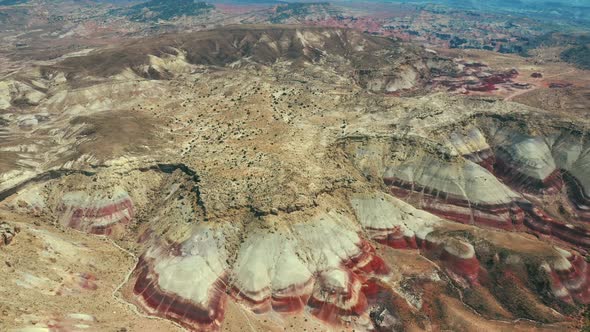 Panoramic View Over Eroded Bentonite Hills In Utah, USA - aerial drone shot