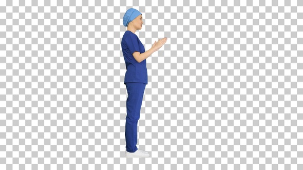 Female doctor in blue uniform talking, Alpha Channel