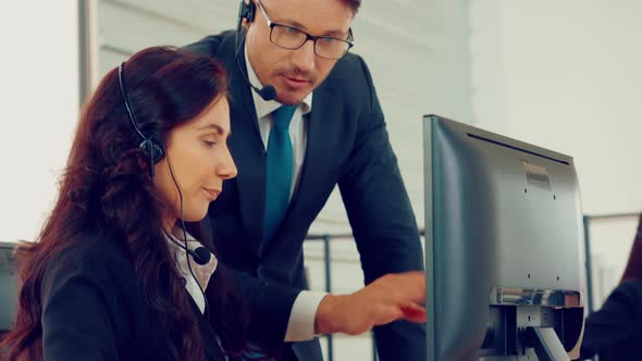 Business People Wearing Headset Working in Office