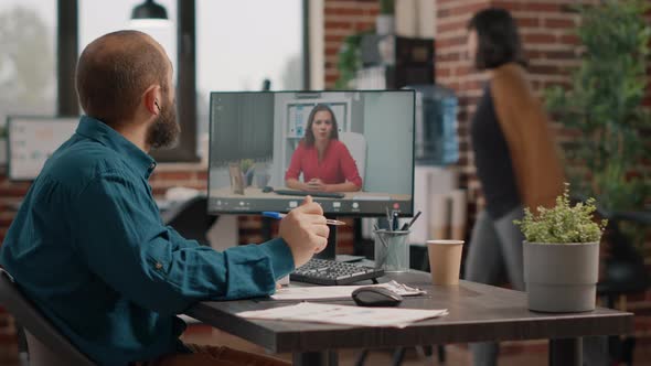 Business Man Using Video Call to Talk to Woman on Computer