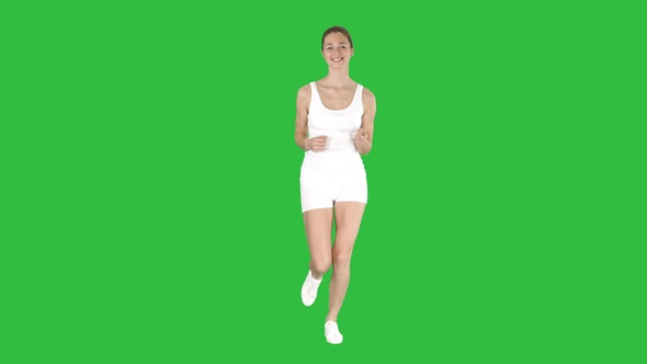 Beautiful woman running on a Green Screen, Chroma Key.