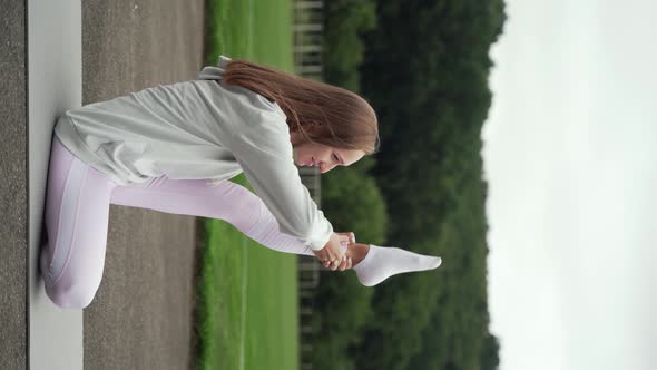 Vertical video, woman exercising outdoors