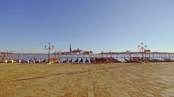 Gondolas Moored To Waterfront on Empty St Marks Square