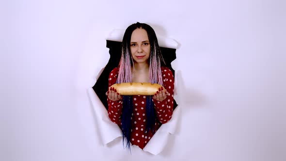 Young Woman Holding White Bread