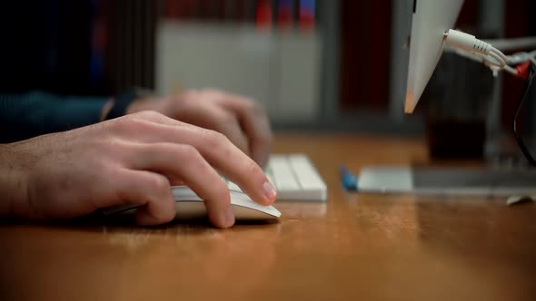 Businessman Hand With Wireless Mouse.Software Developer Man Using Mouse In Office.Overtime Working