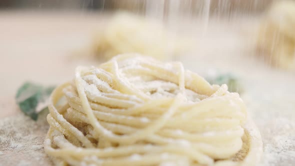 Home Made Pasta on the Table with Flour