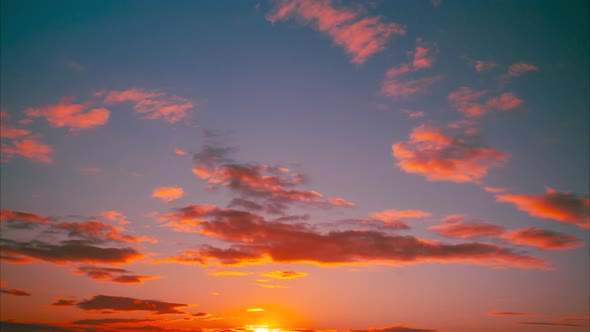 Sunset Cloudy Sky With Fluffy Clouds