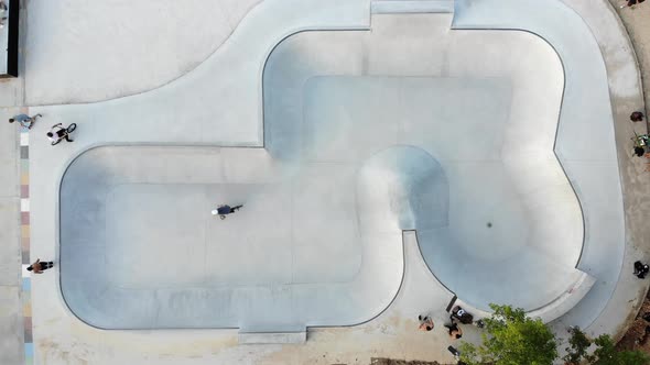 Skate park with men riding bicycles