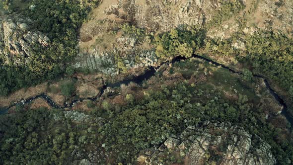 Aerial View of a Mountain River Cutting Through a Rocky Canyon