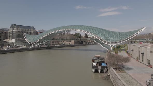 Tbilisi, Georgia - April 2 2021: Aerial view of Tbilisi city central park and Bridge of Peace.