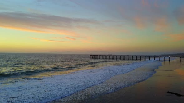 Aerial drone view of a sunset at the beach over the ocean