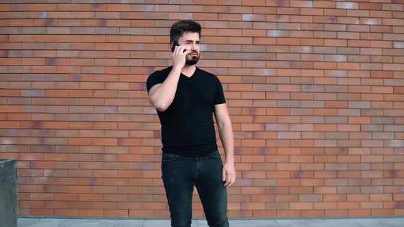 Happy Young Man Talking on the Phone