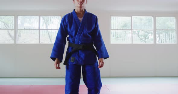 Judoka walking and looking at the camera