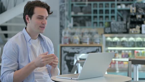 Creative Man Talking on Video Call on Laptop