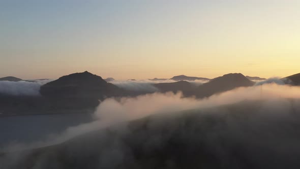 Drone At Sunrise Over Misty Mountains