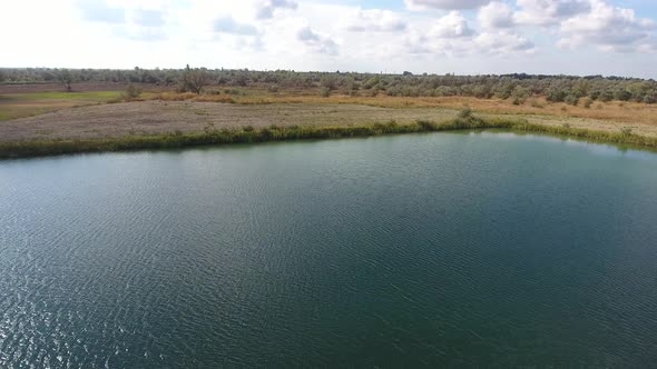 An Artificial Lake for Fishing. A Bridge for Fishermen on the Lake. Lake Fishing