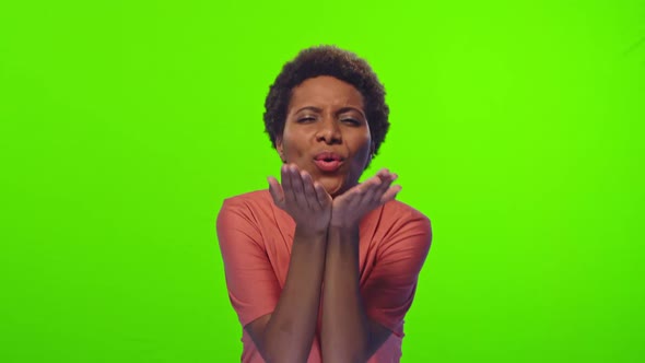 African Woman Blows Air Kiss To Beloved Boyfriend Over Chroma Key Background