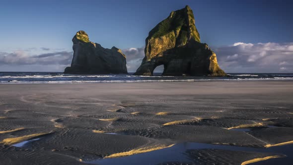 Archway on empty beach