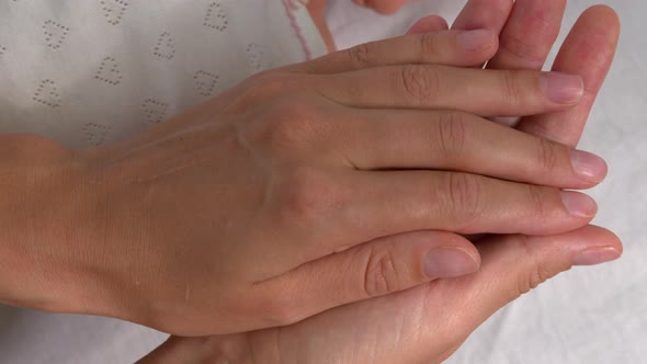 The Mother with Newborn Baby Hand, Holding Baby Hand Feeling Love in Touch.