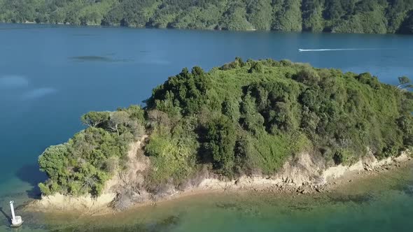 Drone view of a boat in Picton, New Zealand.