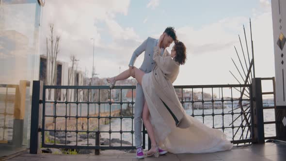 Newlyweds on background of pier
