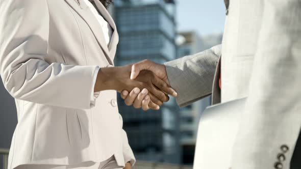 Business Partners Shaking Hands on Street