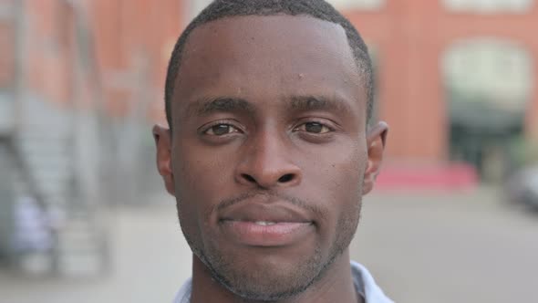 Close Up of Face of African Man Looking at Camera