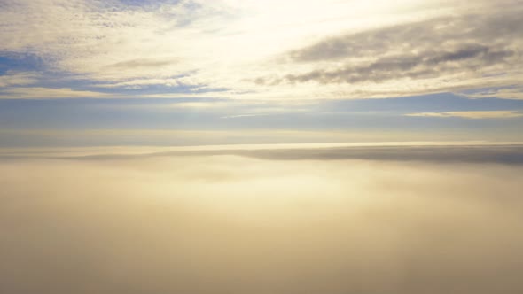 Up from the clouds to the sky in motion. Aerial view white clouds in blue sky