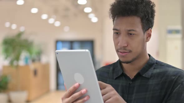 African American Man Using Digital Tablet