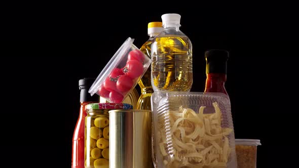 Close-up, Some Nicely Arranged Groceries, Food Products Rotate on Black Background, Grocery Online