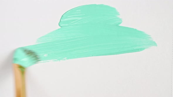 Abstract Brushstrokes of Turquoise Paint Brush Applied Isolated on a White Background