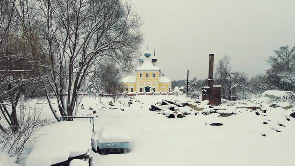 Snowcovered Winter Village Landscape with a Stove on the Ashes Aerial View