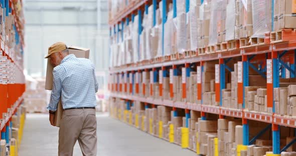 Warehouse worker holding packages