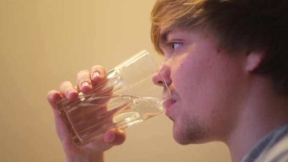 Man drinking filtered mineral clear water