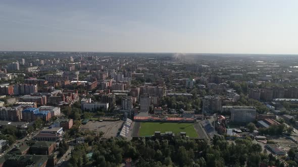 Aerial view of city with lots of trees and stadium 09