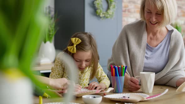 Tracking video of little girl drawing Easter bunny. Shot with RED helium camera in 8K.