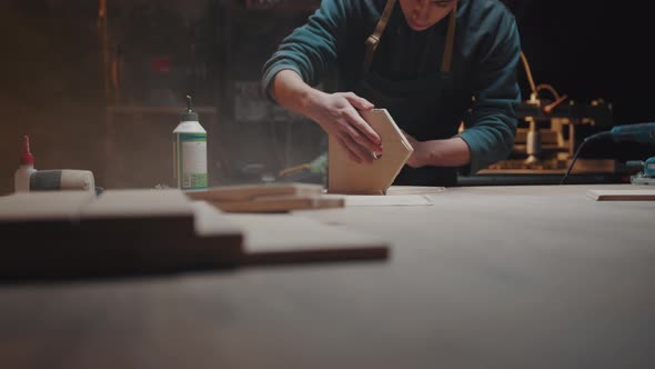 The Master Constructs Wooden Houses for Animals in His Workshop