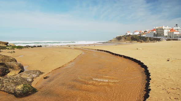 Aerial Drone View of Sandy Beach at Lisbon, Portugal at Praia das Macas, a Beautiful Coastal Town on